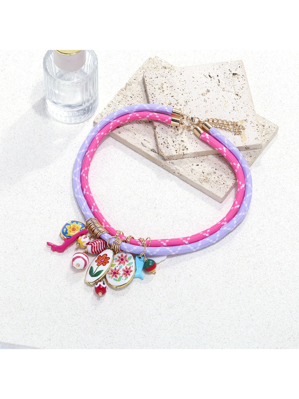 Neckit Charm Cluster Necklace displayed on a white background highlighting rope chain