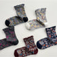 Rufia Heart White Mid-Calf Socks displayed with one sock slightly overlapping the other