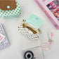 Cosbai mini polka dot pouch bag with zipper partially open showing contents