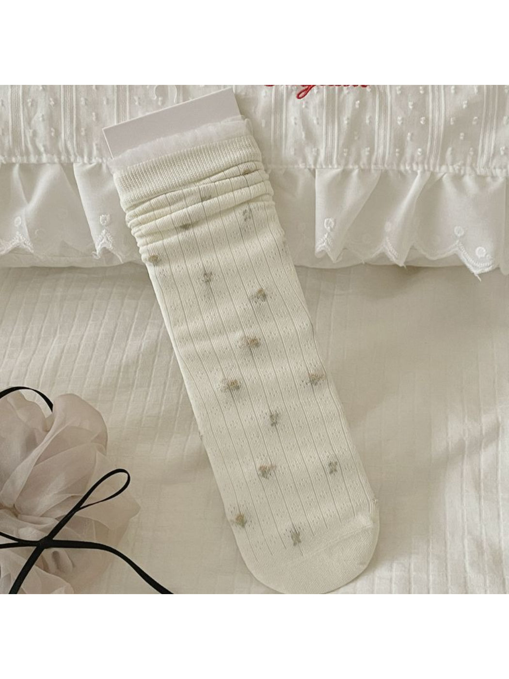 Rufia crew socks styled with rolled-up jeans on model