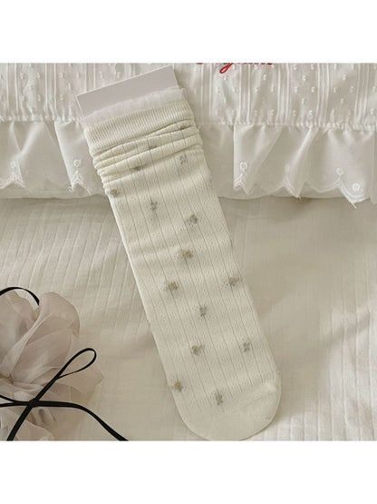 Rufia crew socks styled with rolled-up jeans on model