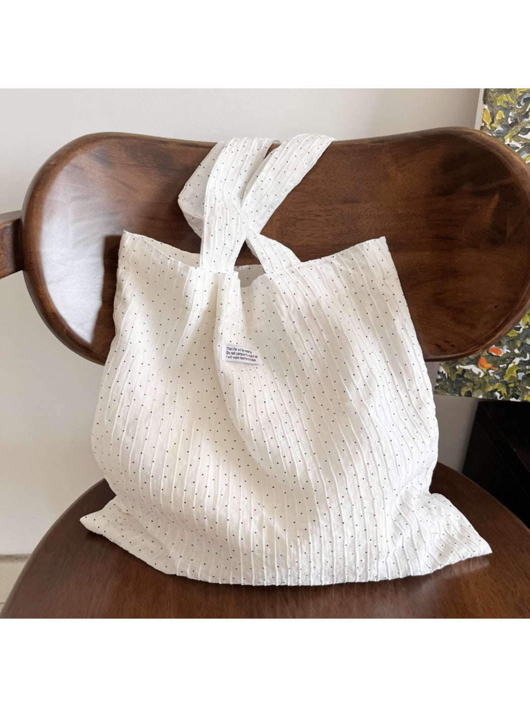 Cosbai white crinkle tote bag with small black dots, front view