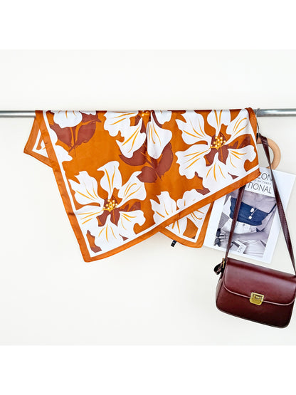Scarvii Lily Print Square Scarf styled as a belt on jeans highlighting floral print and fabric detail