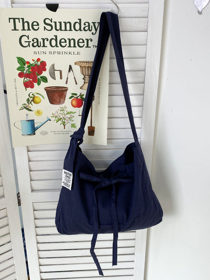 Back view of Cosbai slouchy shoulder bag highlighting smooth finish