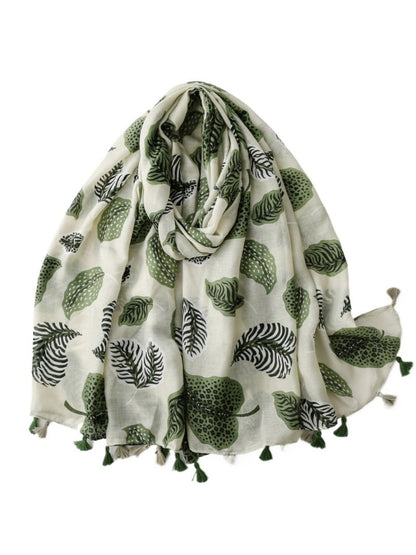 Close-up of Scarvii Jungle Leaf Fringe Scarf fabric texture and detailed leaf print