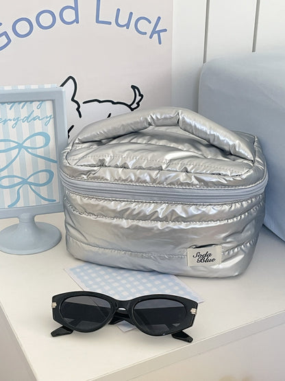 Cosbai makeup organizer bag open with various cosmetics inside
