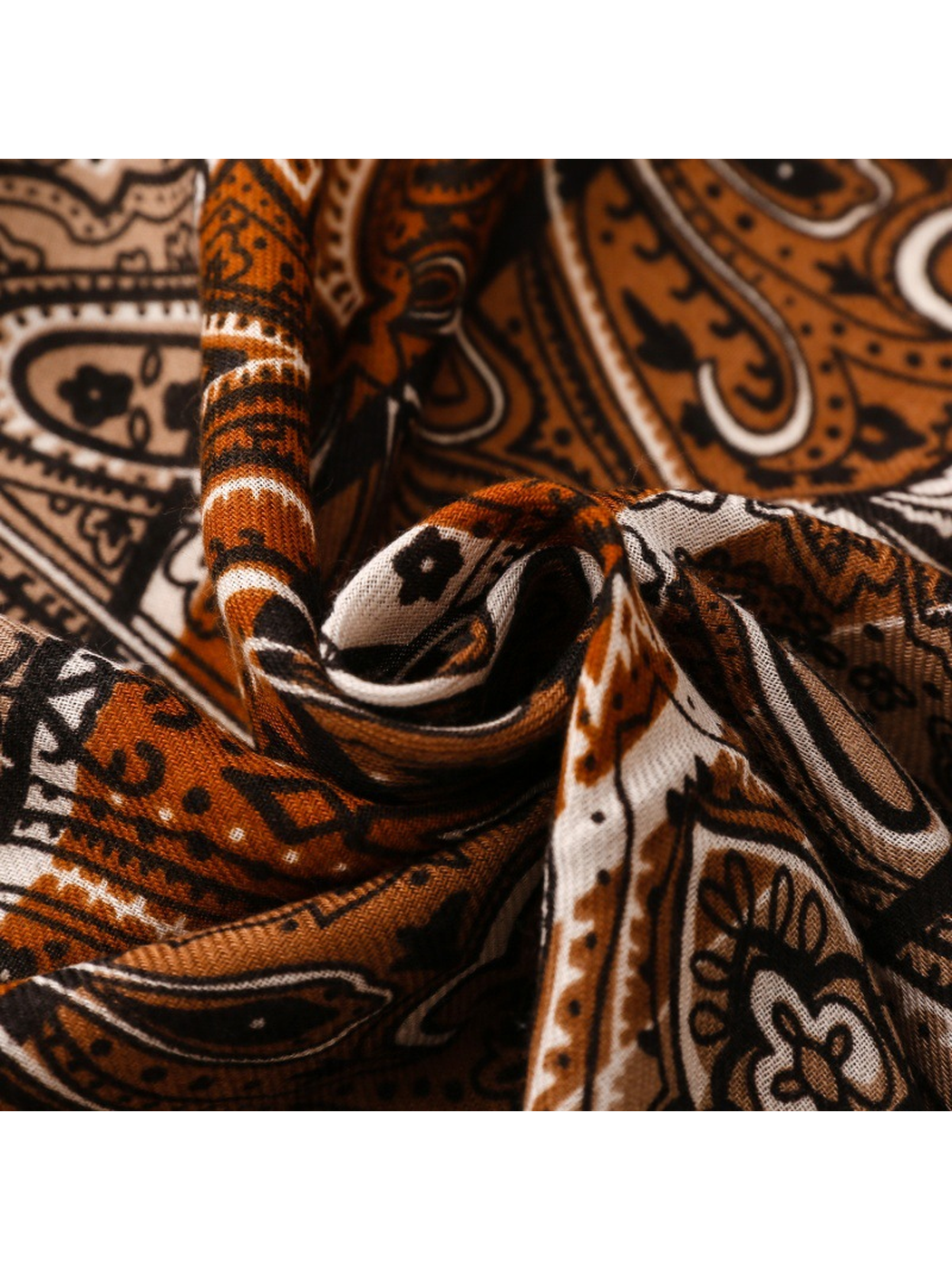 Close-up of Paisley scarf folds and finely textured ornamental print