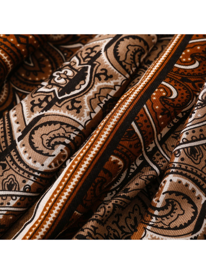 Close-up of Paisley scarf motifs and narrow striped border