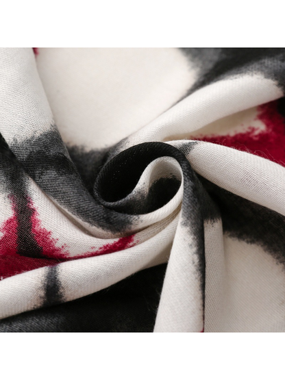 Close-up of abstract floral scarf curled into soft folds