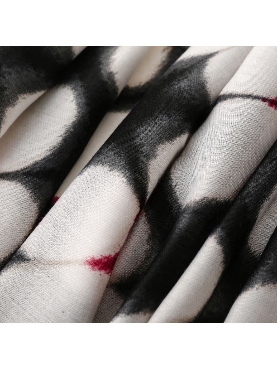 Close-up of Floral scarf fine weave and black-and-white printed folds