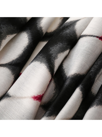Close-up of Floral scarf fine weave and black-and-white printed folds