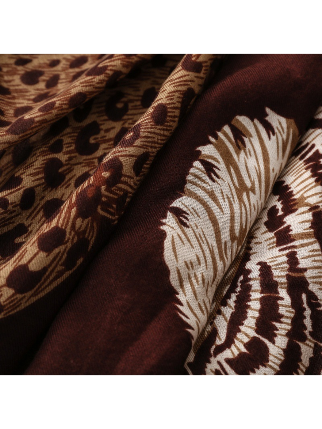 Close-up of Leopard scarf tan spots and cream tiger markings on burgundy