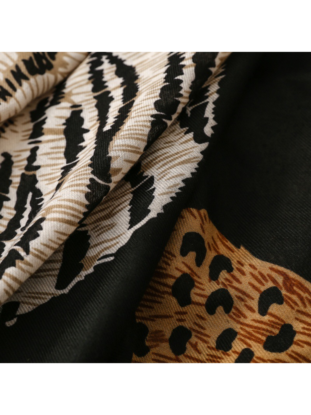 Close-up of Tiger scarf cream stripes and tan leopard spots on black