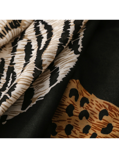 Close-up of Tiger scarf cream stripes and tan leopard spots on black