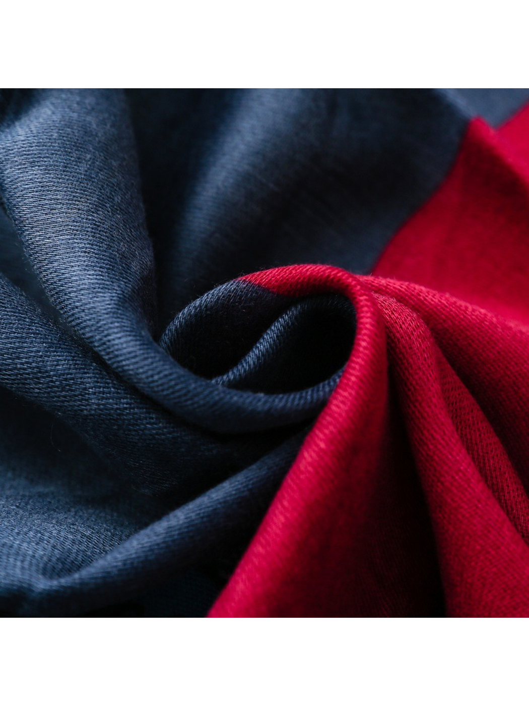 Close-up of navy and red scarf panels with fine woven texture