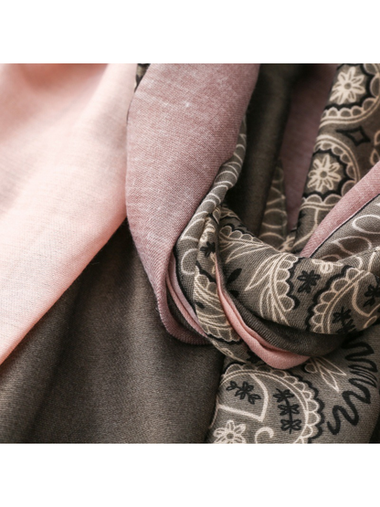 Close-up of pale pink and mauve panels beside the gray paisley border