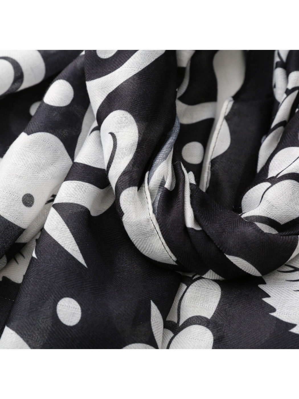 Close-up of the fine weave appearance and black and white botanical motif