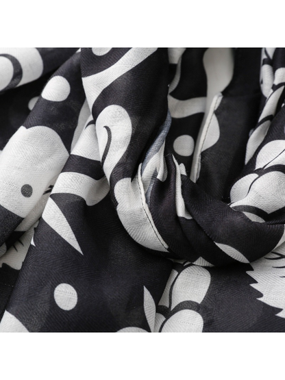 Close-up of the fine weave appearance and black and white botanical motif