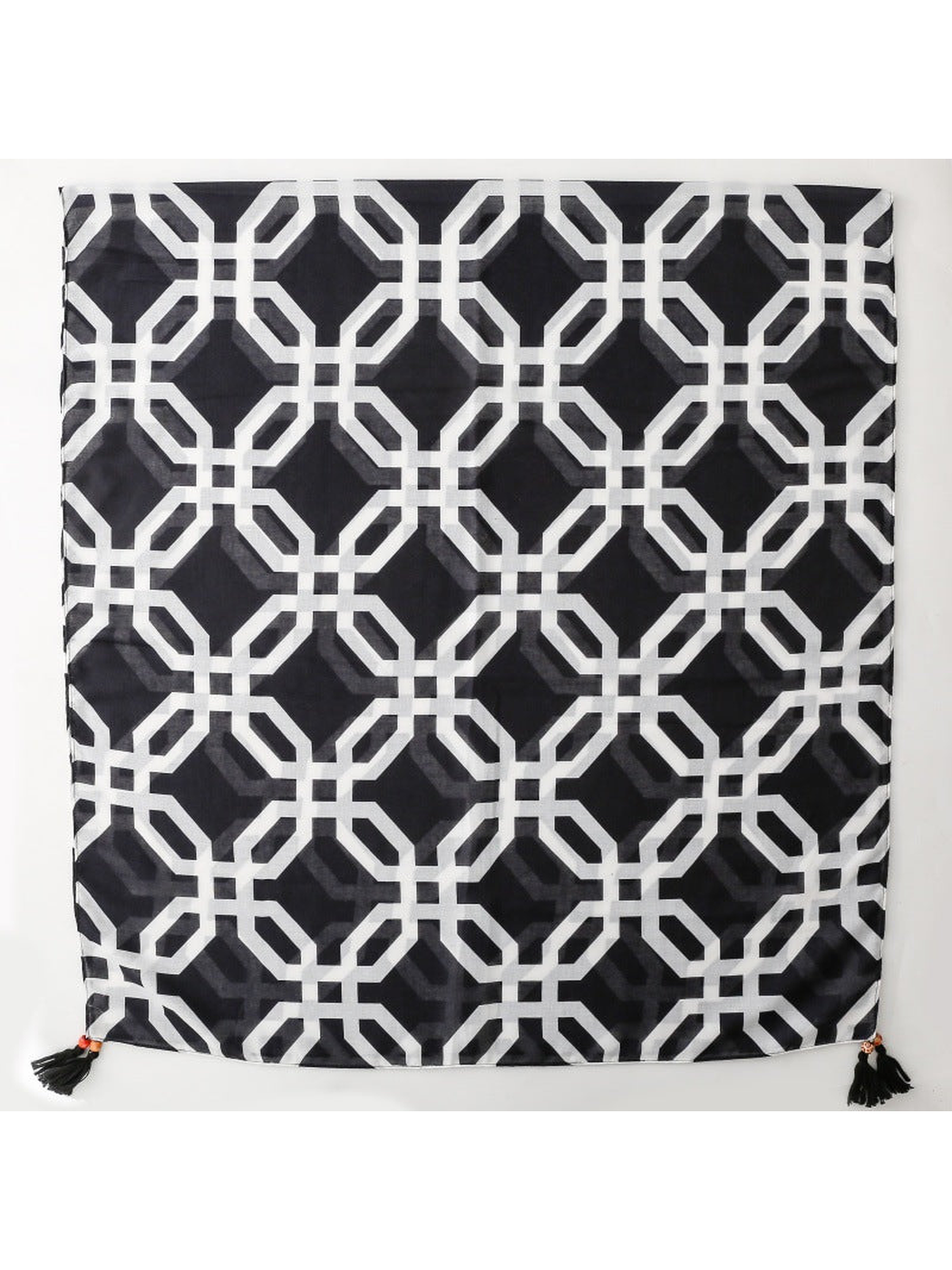 SL2607-056 black and white geometric lattice scarf laid flat with corner tassels