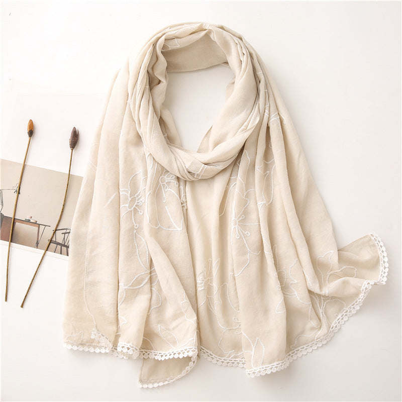 Beige floral embroidered lace trim shawl in a draped product view