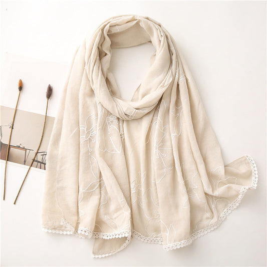 Beige floral embroidered lace trim shawl in a draped product view