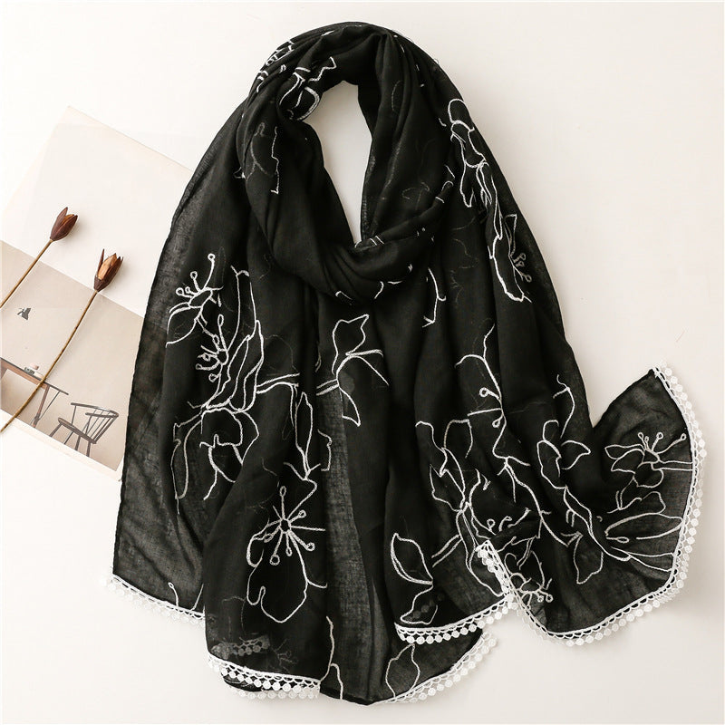 Black floral embroidered lace trim shawl in a draped product view