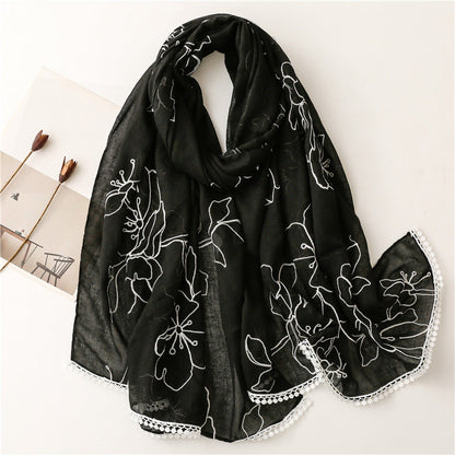 Black floral embroidered lace trim shawl in a draped product view