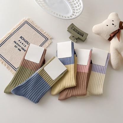 Pair of Rufia contrast stripe socks in black and white with bold horizontal stripes