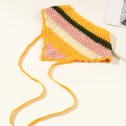 Side view of yellow woven hairband highlighting fabric weave and thickness