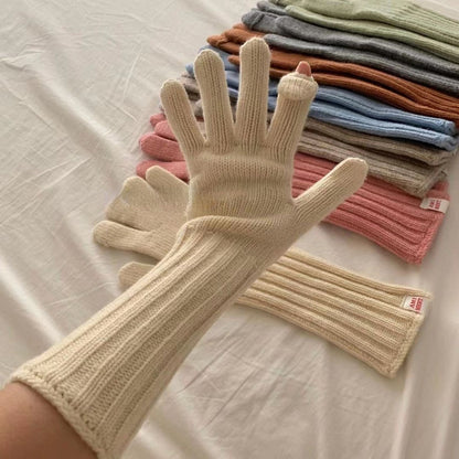 Pair of gray knitted gloves with long ribbed sleeves displayed flat