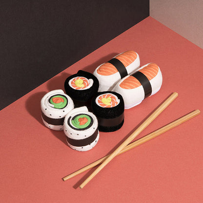 Three pairs of colorful sushi-themed socks displayed flat
