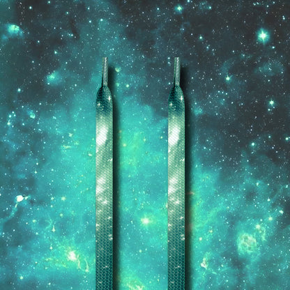 Flat shoelace with galaxy print threaded through sneaker eyelets