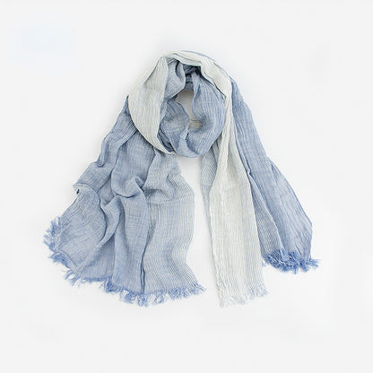 Model adjusting Scarvii summer styling Farmhouse Scarf in front of a farmhouse window
