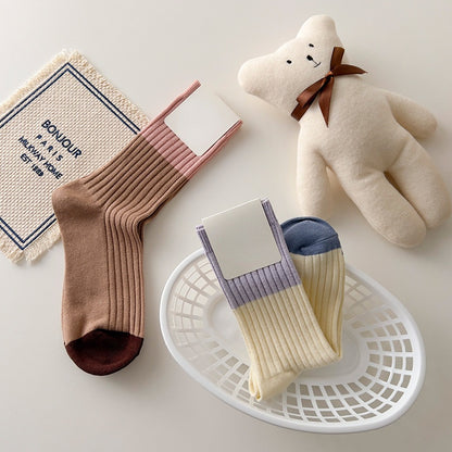 Five pairs of Rufia contrast stripe socks in assorted colors arranged side by side
