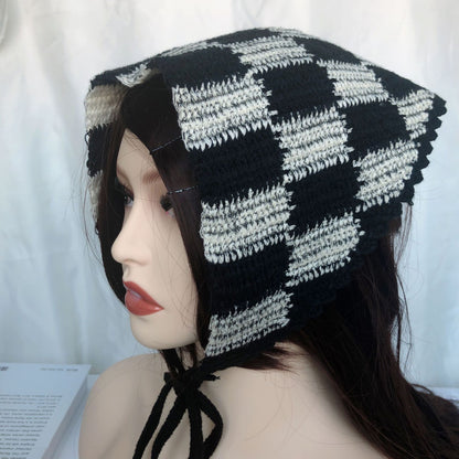 Woven vintage hairband paired with casual outfit on model in indoor setting