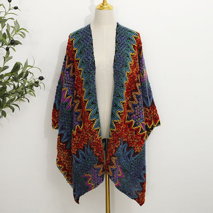 Boho style shawl in neutral tones with a front pocket, draped over a mannequin