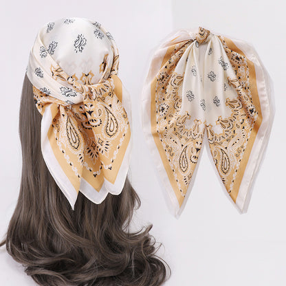 Woman adjusting Scarvii Geometry Scarf Head Wrap with visible geometric pattern and soft fabric
