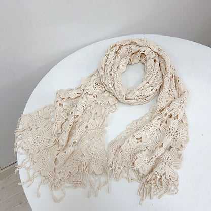 Model wearing cream boho crochet shawl scarf outdoors