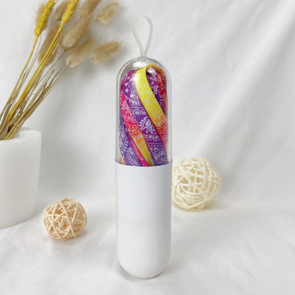 Star colorful shoe laces threaded through white sneakers with star print