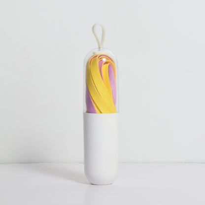Multiple pairs of vibrant shoe laces displayed in a fan shape
