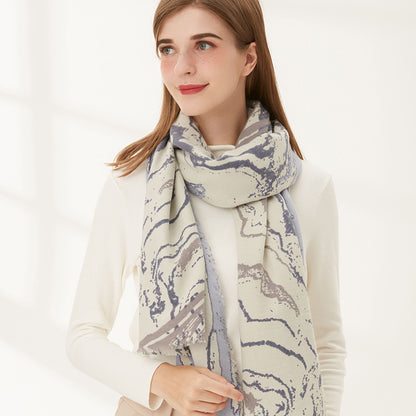 Scarvii marble long scarf styled as a head wrap on model with neutral background
