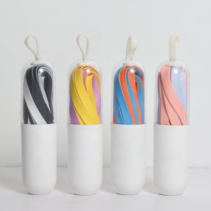 Close-up of colorful shoe laces in various bright colors arranged side by side