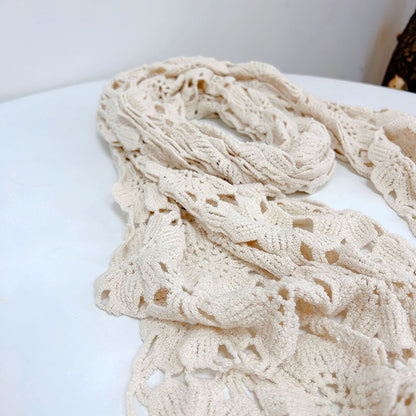 Side view of cream crochet shawl scarf with fringe detailing