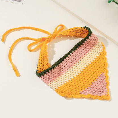 Close-up of woven yellow hairband with textured fabric design
