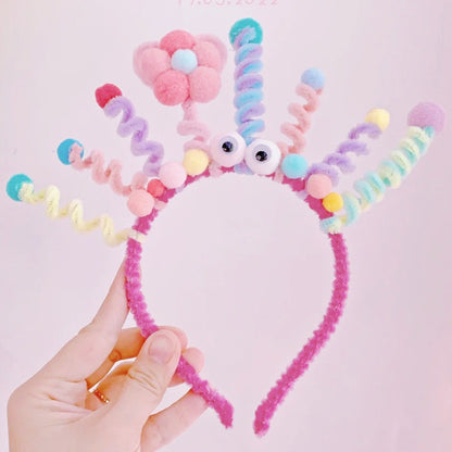 Kaca party cute headband with colorful pom-poms on a white background