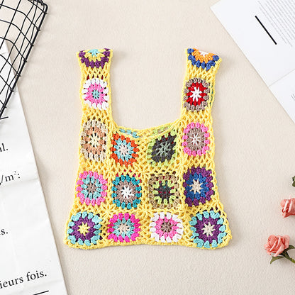 Cosbai Bohemian vintage crochet bag with strap extended on flat surface