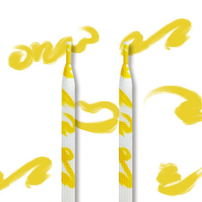 Shoeya graffiti flat shoelaces threaded through white sneaker eyelets