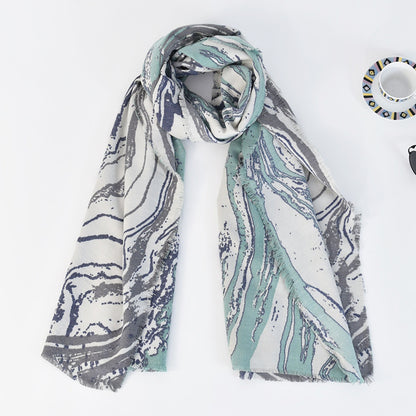 Scarvii marble long scarf displayed on hanger highlighting length and pattern