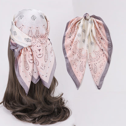 Side view of woman wearing Scarvii Geometry Scarf Head Wrap with geometric shapes in beige and brown