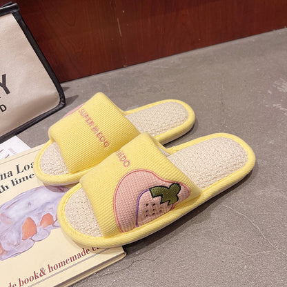 Slipeer slippers displayed on wooden floor highlighting vibrant fruit patterns